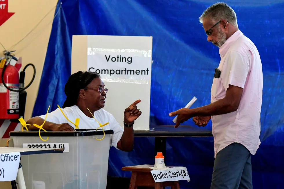 Finger pointing: a Guyanese man casts his vote during general elections held on 2 March 2, but a close race and slow returns have fed accusations of vote rigging