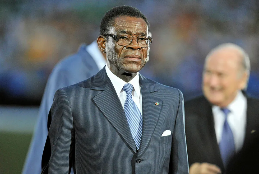 (FILES) This file photo taken on February 12, 2012 shows Equatorial Guinea's President Teodoro Obiang Nguema walking on the pitch before the start of the final match of the 2012 African Cup of Nations (CAN 2012) opposing Zambia to Ivory Coat at the stade de l'Amitie in Libreville. Equatorial Guinea President Teodoro Obiang Nguema has rejected opposition claims that one of its activists died in custody after being tortured, and that some 200 of their number are under arrest. In an interview late on January 16, 2018 with French radio station RFI and France 24 television, Africa's longest-serving president confirmed the death in custody of an opposition activist but put it down to ill health. / AFP PHOTO / Issouf SANOGO