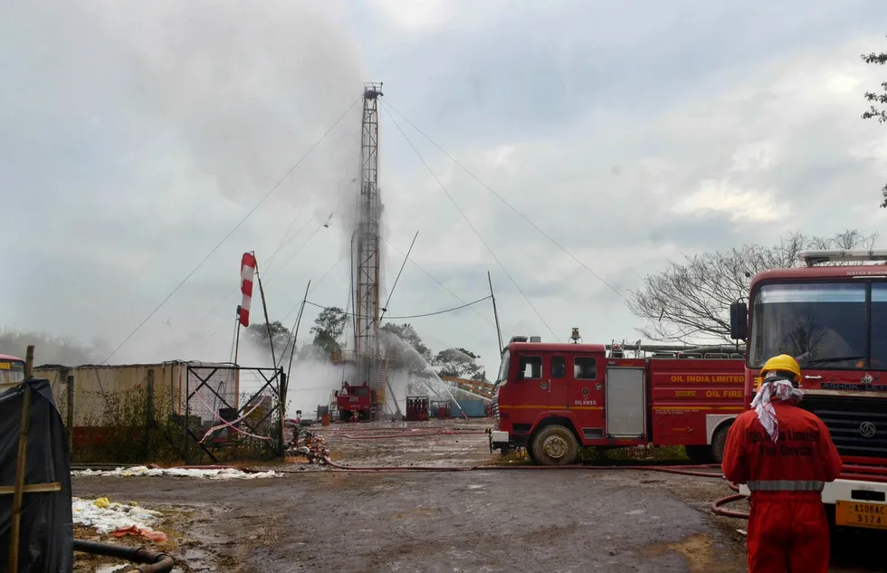 Inquiry: an Oil India Limited firefighter oversees works near a well site following the 27 May blast at the Baghjan oilfield in Tinsukia district