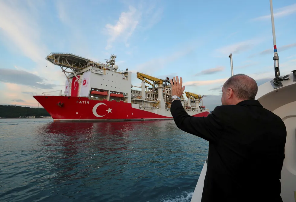 Exploration success: Turkey's President Recep Tayyip Erdogan waves as the drilling vessel Fatih departs for the Black Sea during a ceremony in Istanbul in late May.