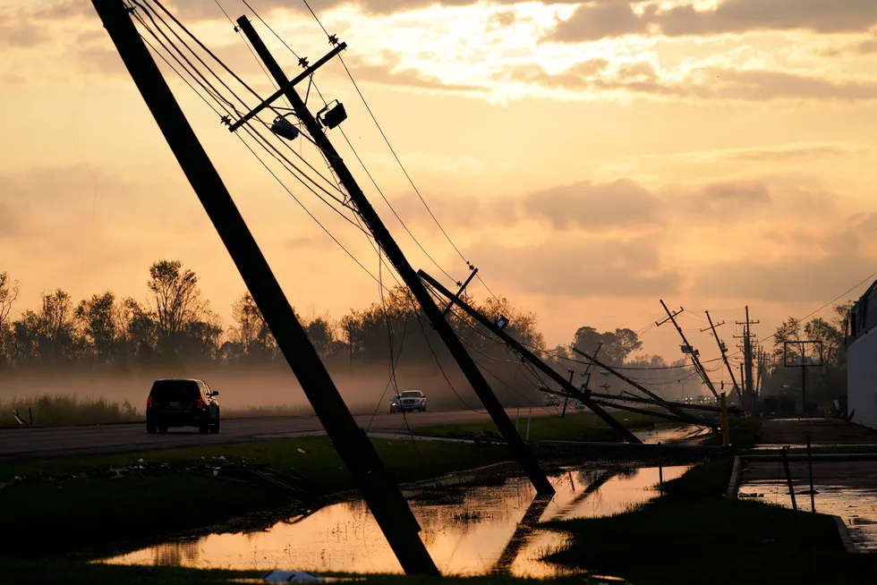 Slow recovery: Downed power lines slump over a road in the aftermath of Hurricane Ida. There are about 164,000 customer power outages remaining in Louisiana as of 13 September, according to the US Department of Energy