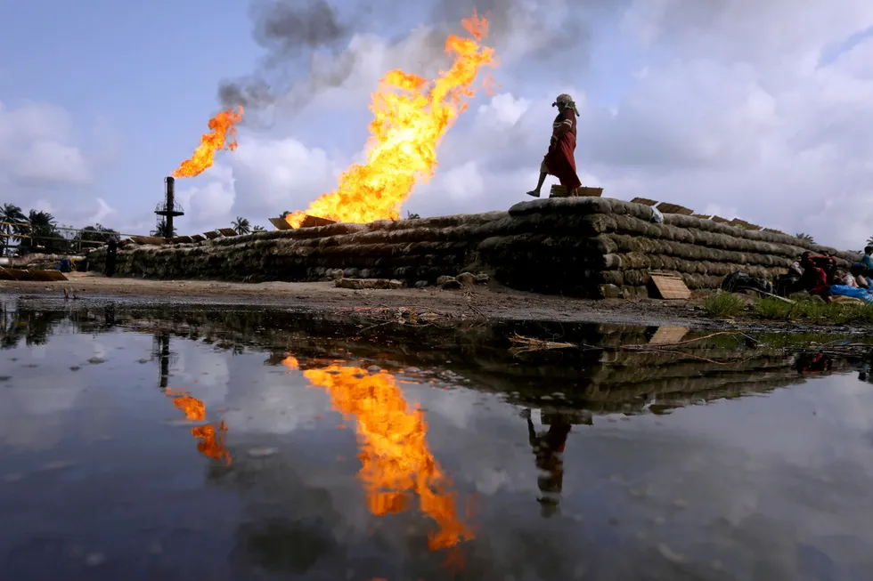 Poor reflection: two gas flaring furnaces at a flow station in Nigeria's Delta State