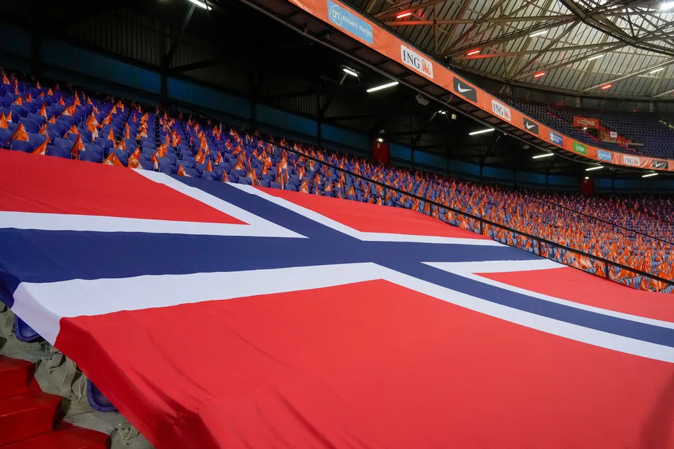 Headed for Norway: A giant Norwegian flag is hung across empty seats at De Kuip stadium in the Netherlands ahead of a world cup qualifying soccer match this month