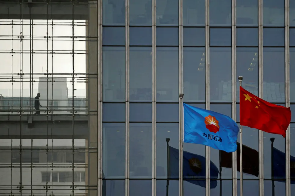 Reforms: the flag of CNPC flies next to a Chinese national flag at the company's headquarters in Beijing