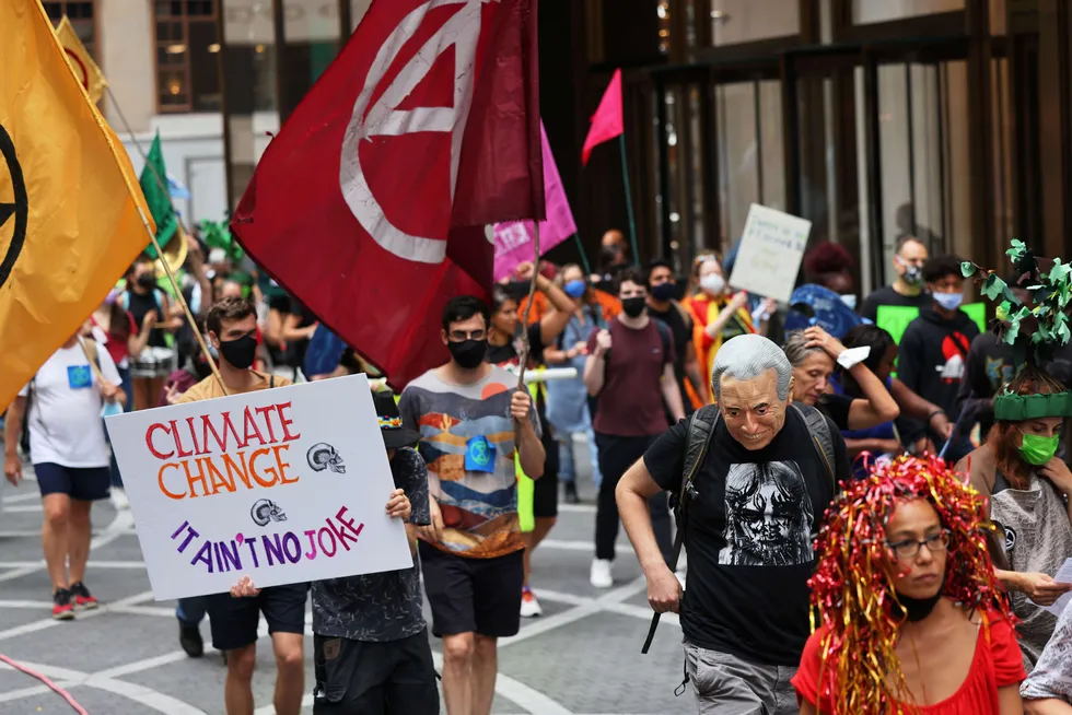 Pressure point: People protest in New York City to highlight climate change impacts. The oil industry faces growing pressure to transition to cleaner energy sources, creating recruitment challenges.