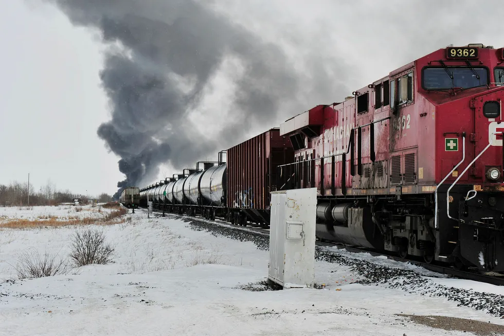 Smoke rises from a fire at the site of a CP Rail train-car derailment near Guernsey, Saskatchewan, Canada, on February 6, 2020.