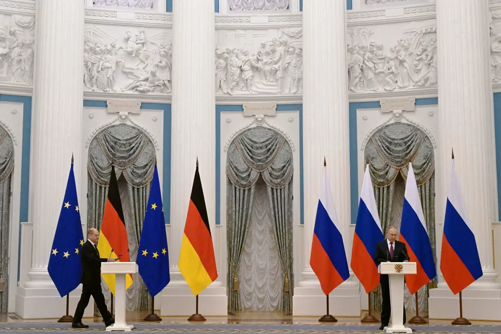 Luring promise: German Chancellor Olaf Scholz (left) walks into a joint press conference with Russian President Vladimir Putin in Moscow this week