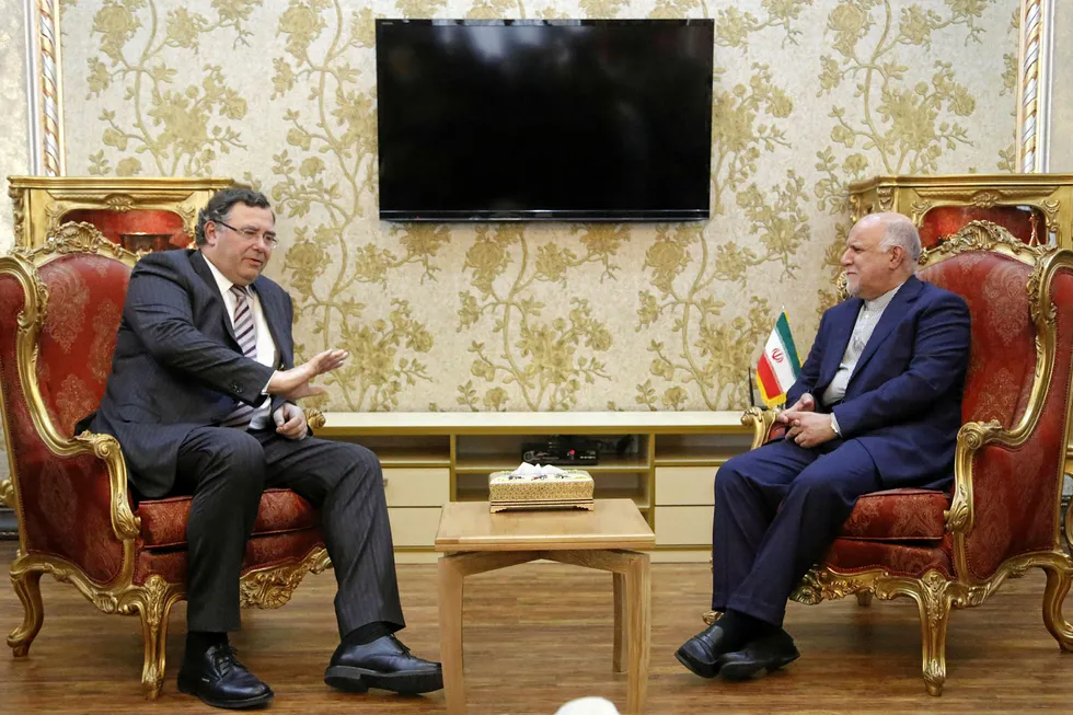 In the balance: Total chief executive Patrick Pouyanne with Iranian Oil Minister Bijan Namadar Zanganeh after signing the South Pars 11 contract