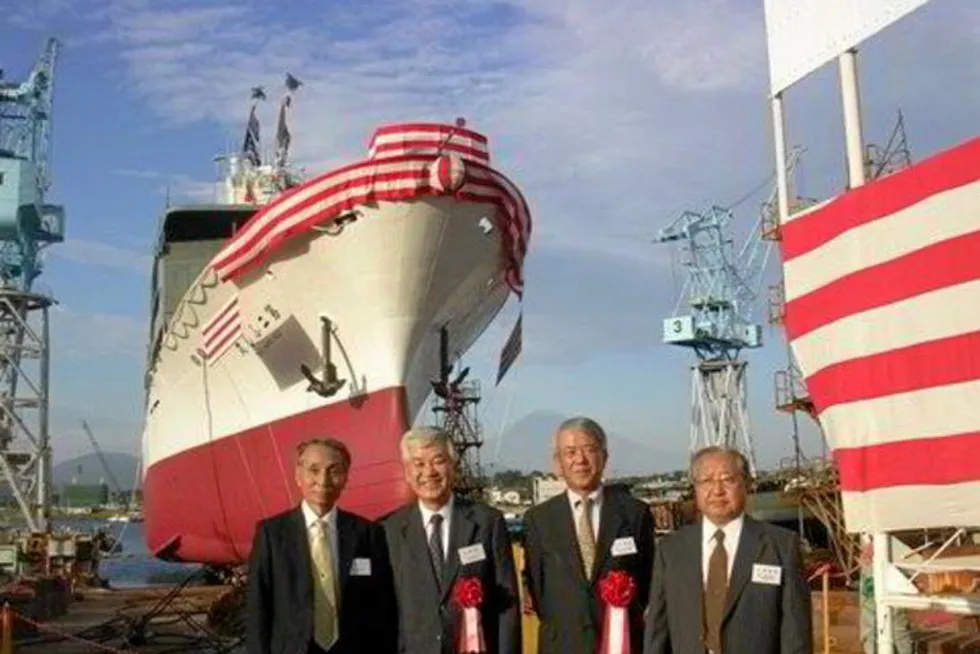Yuji Igarashi (second from left) with colleagues at a Maruha Nichiro vessel launch in 2009.
