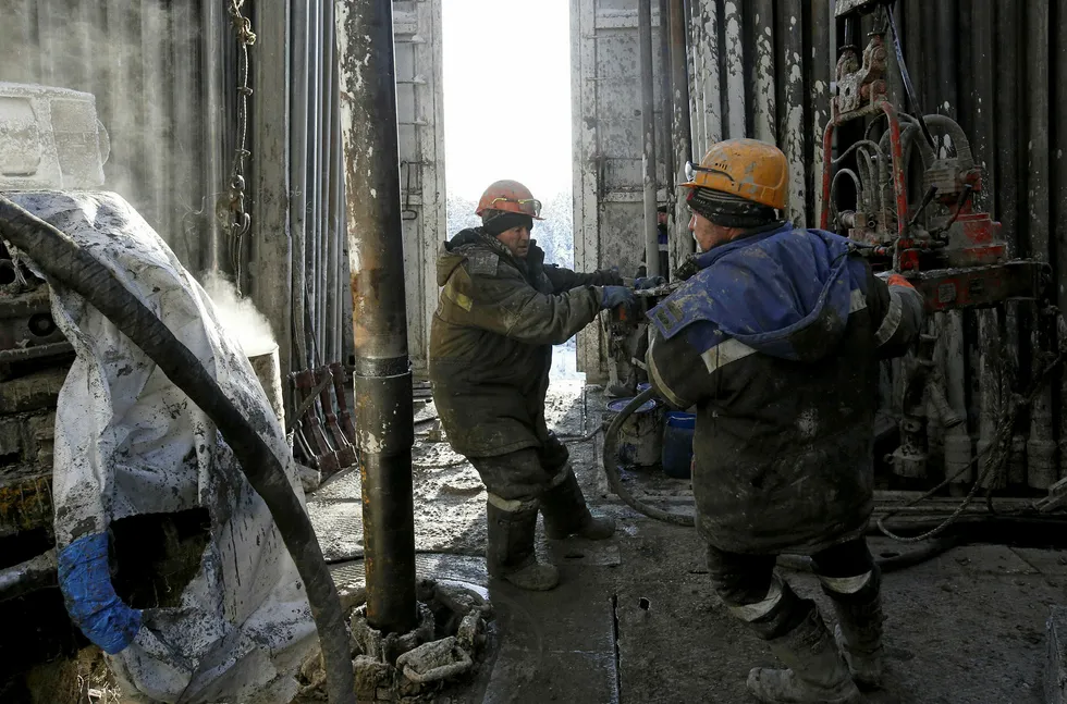 On location: workers on a drilling rig at the Rosneft-owned Samotlor oilfield