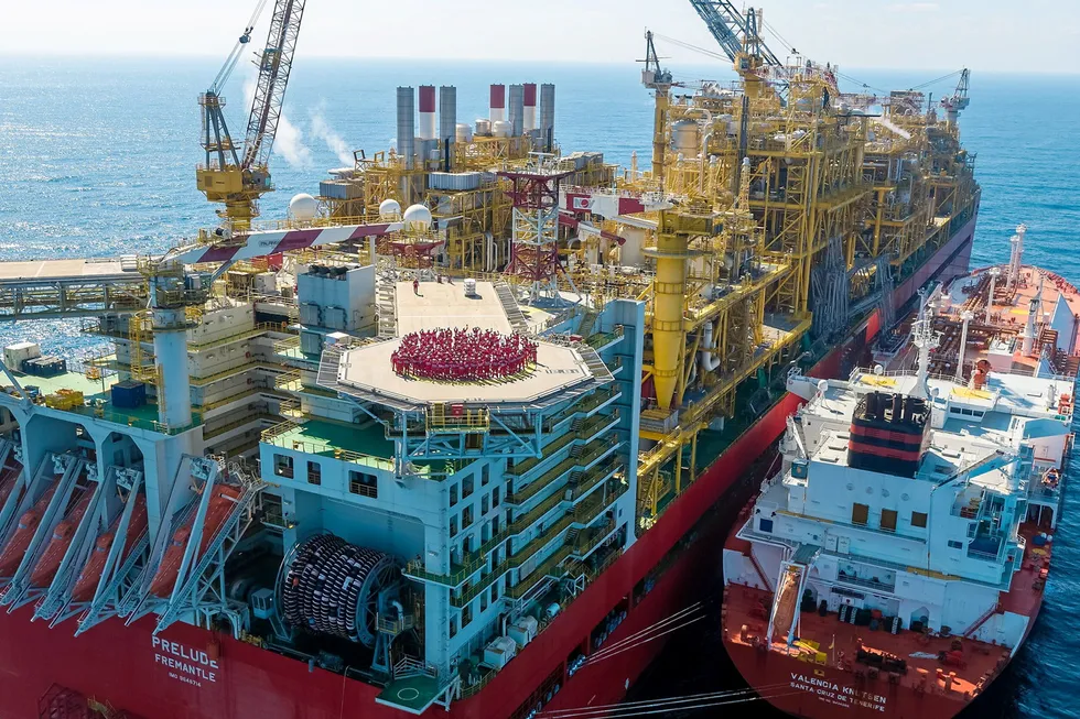 Back to work: workers on the helideck of the Prelude FLNG facility