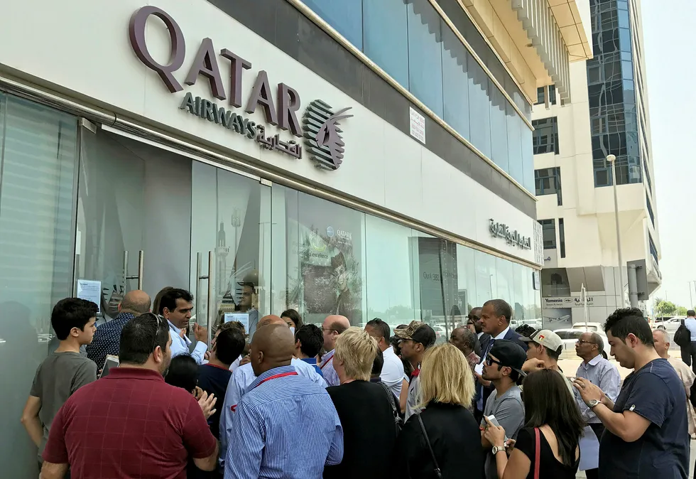 Crowded out: people gather outside a branch of Qatar Airways in Abu Dhabi after Saudi Arabia and its allies imposed a flight ban on Qatar