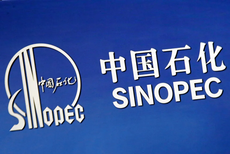FILE PHOTO: The company logo of China’s Sinopec Corp is displayed at a news conference in Hong Kong, China March 26, 2018. REUTERS/Bobby Yip/File Photo