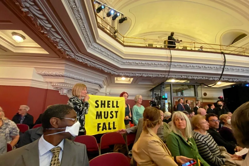 Protest: dozens of climate protesters disrupted Shell's annual shareholder meeting on Tuesday, chanting slogans and holding banners