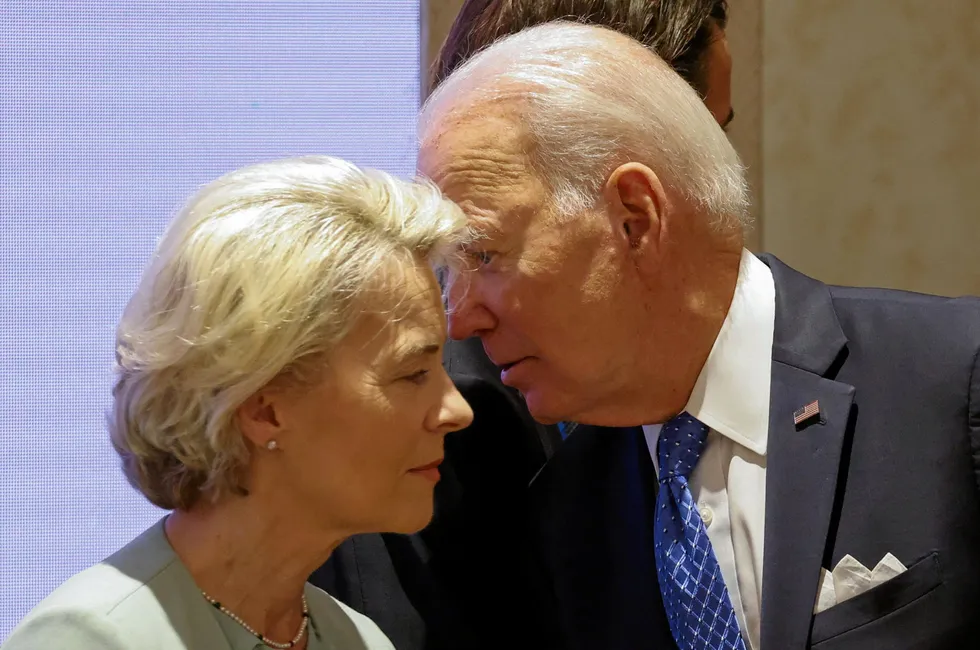 US President Joe Biden leans into the ear of European Commission President Ursula von der Leyen at the G20 Leaders' Summit in New Delhi on Saturday.