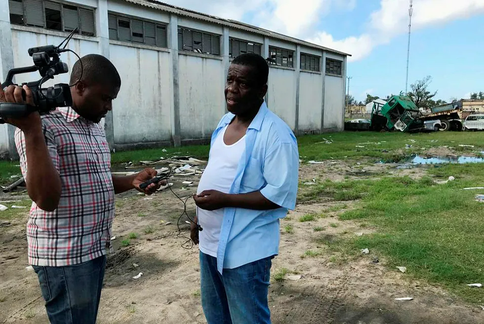 Plea: Daviz Simango (right) MDM president and mayor of Beira, takes a break from directing disaster relief operations after a cyclone in March