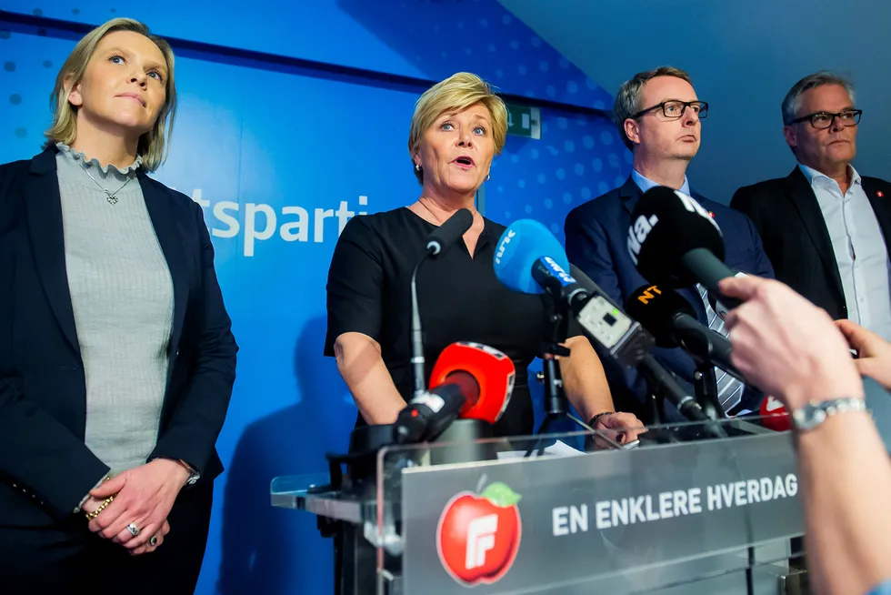 Exit: Progress Party leader Siv Jensen (right) flanked by Petroleum & Energy Minister Sylvi Listhaug announcing the decision on Monday