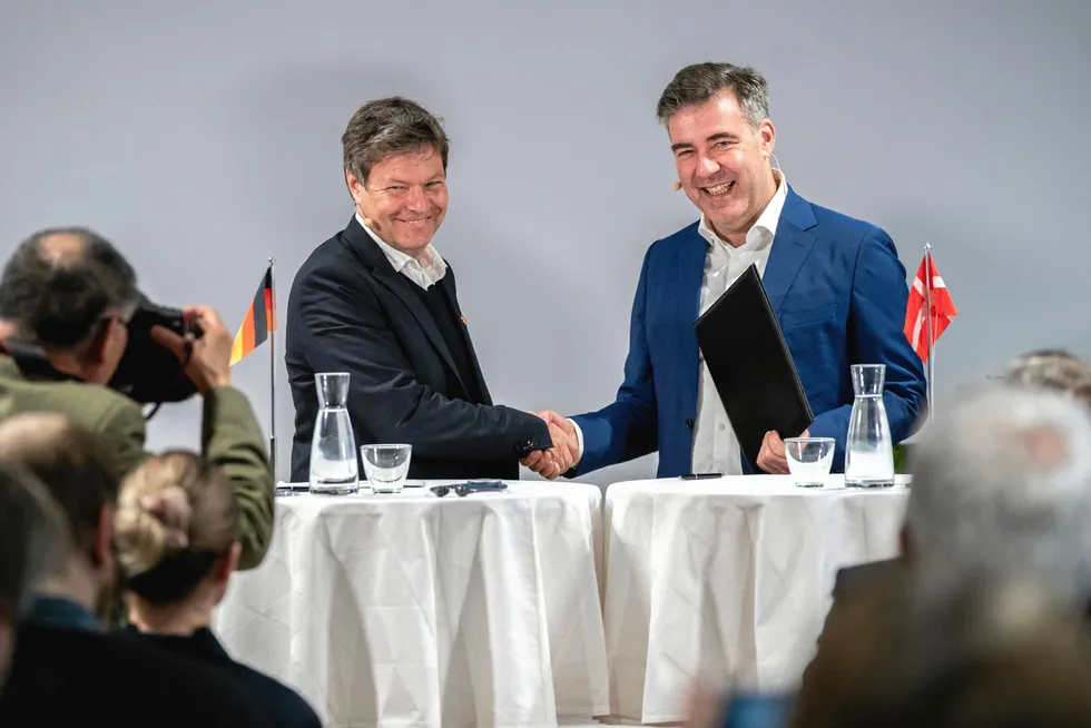 German climate minister Robert Habeck, left, shakes hands with his counterpart Lars Aagard in Copenhagen after signing the pipeline agreement.