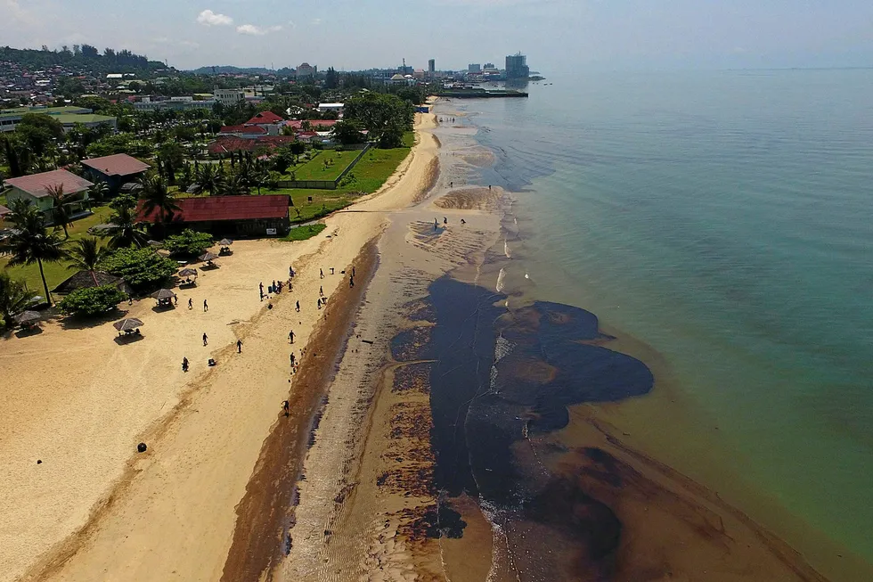 Clean-up: a slick from the oil spill on Kemala beach in Balikpapan, Indonesia