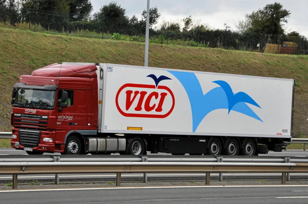 A truck branded with Viciunai Group's 'Vici' logo.