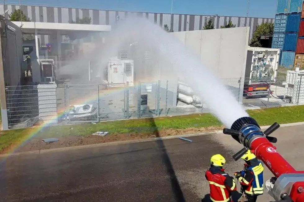 The local fire brigade pouring water onto the source of the fire at the hydrogen refuelling station in Gersthofen, Bavaria.