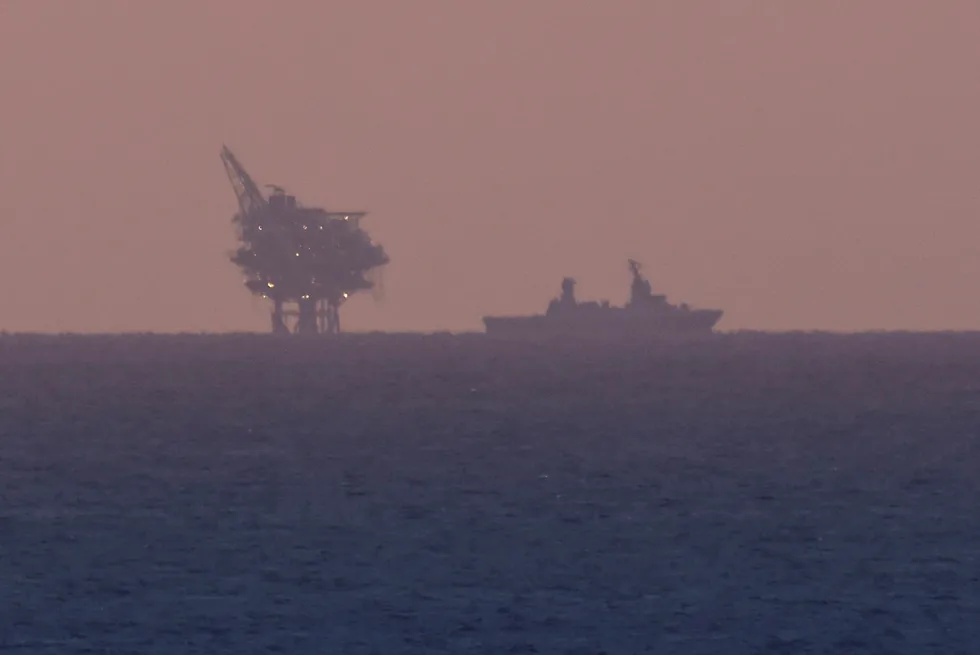 Threat: Chevron’s Leviathan gas platform offshore Israel as an Israeli Navy vessel patrols the Mediterranean Sea off Ashkelon, close to Gaza on 14 November.