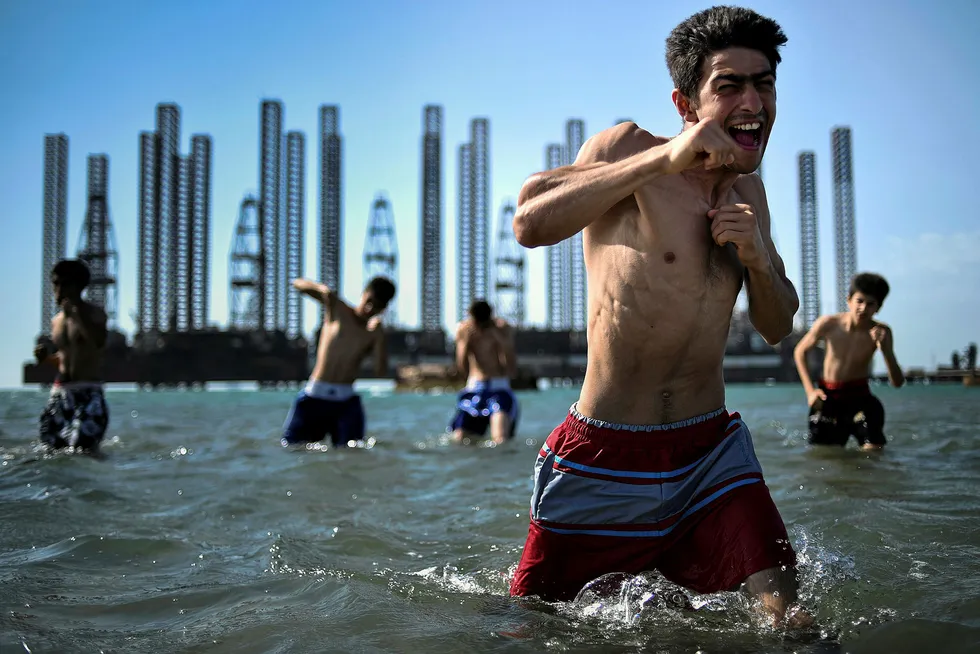 Heavy hitters: youths from a boxing school take part in a training session in the Caspian Sea near Baku