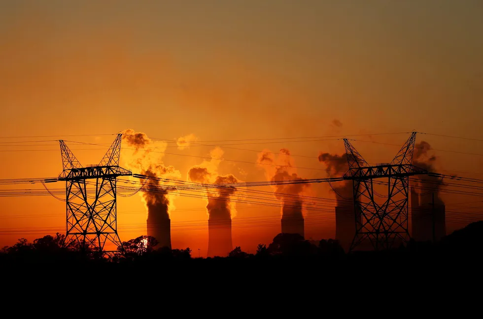 Fossil fuel: electricity pylons are seen in front of the cooling towers at the Lethabo thermal power station, an Eskom coal-burning power station near Sasolburg in South Africa's northern Free State province