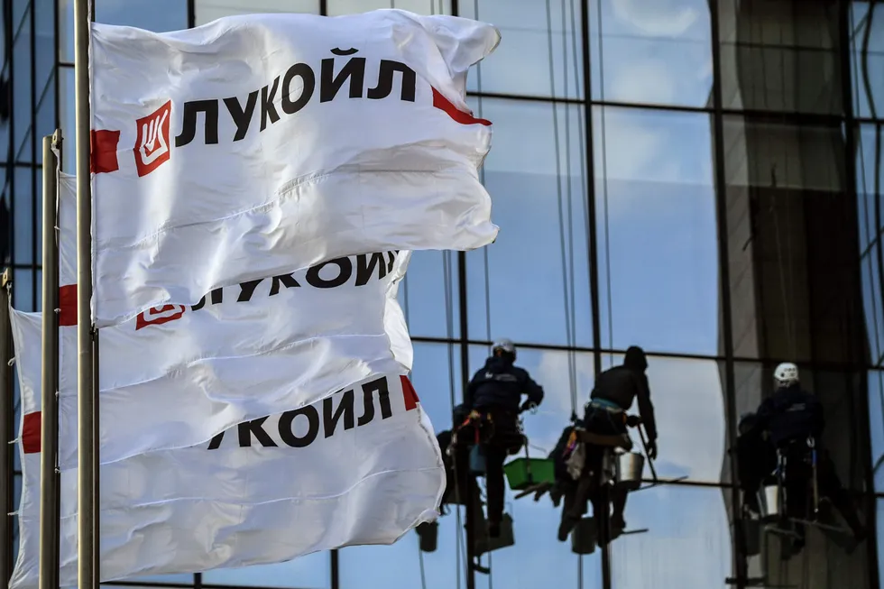 Clear vision: workers clean windows at Luikoil's Moscow headquarters