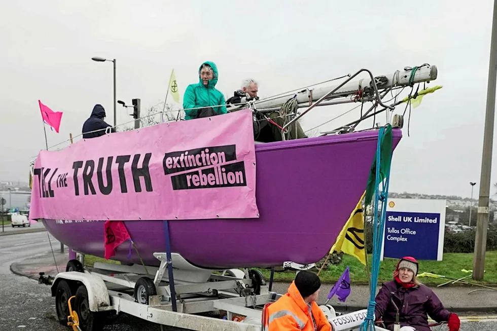 Course of action: Extinction Rebellion campaigners are blockading entrances to Shell's offices in Aberdeen