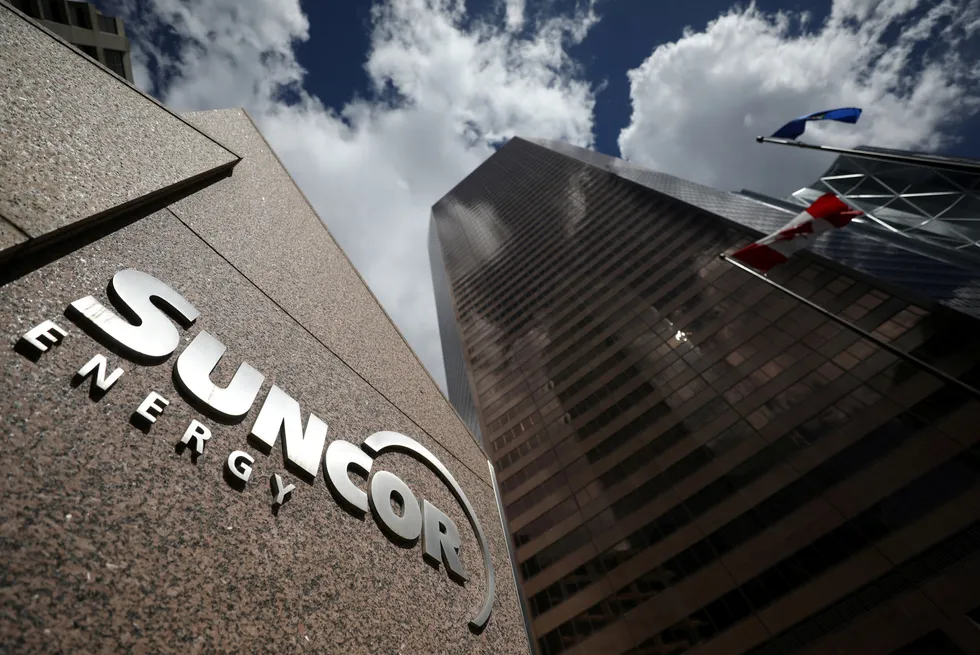 Output record: Suncor Energy logo is seen at company's head office in Calgary, Canada.