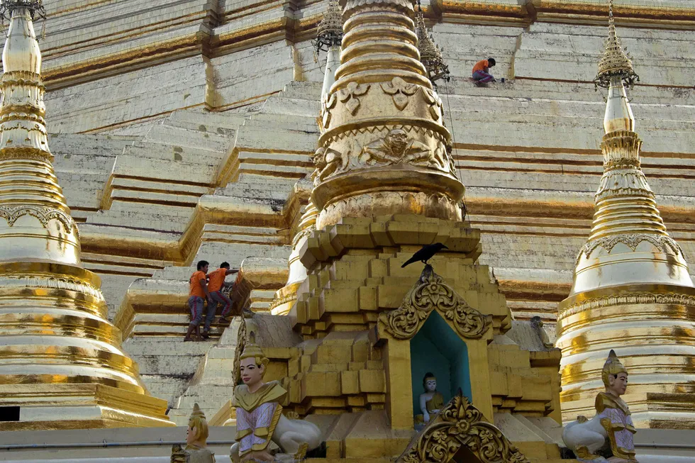 On site: workers carry out repairs on the Shwedagon pagoda in Yangon. Block A-5 lies about 200 kilometres northwest of the commercial capital