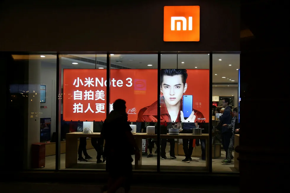 Xiaomi er blitt verdens fjerde største smarttelefonprodusent og er markedsleder i India. Nå går det mot børsnotering. Selskapets første ansatte vil bli mangemillionærer. Foto: China Stringer Network/Reuters/NTB Scanpix