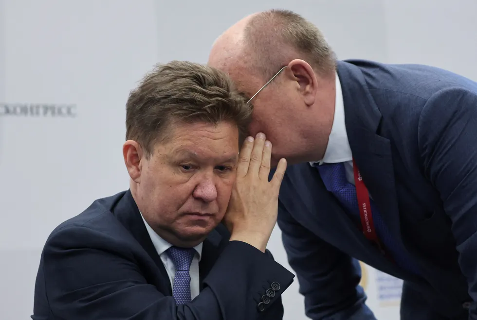 Listening: Gazprom executive board chairman Alexei Miller listens to a delegate at the St Petersburg International Economic Forum in Russia
