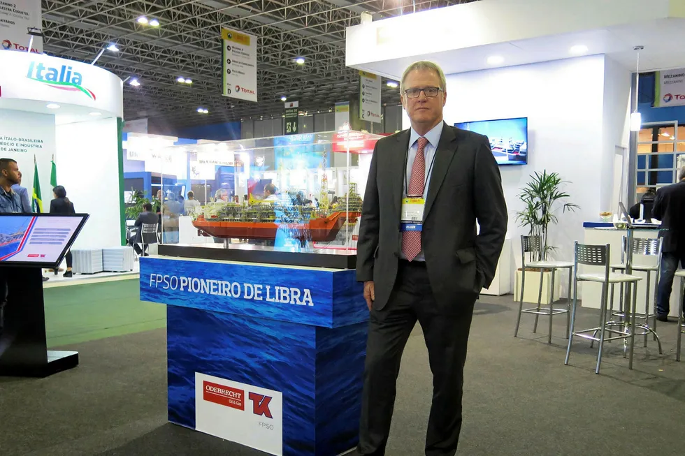 Projects: OOG superintendent director of offshore integrated services Jorge Luiz Mitidieri beside with a model of the Pioneiro de Libra FPSO
