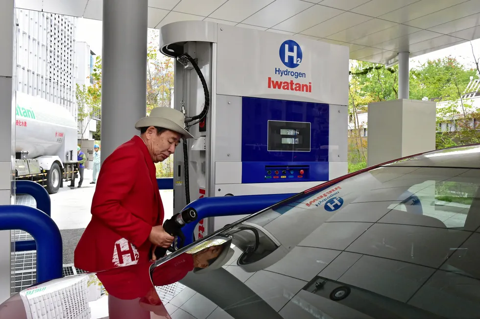 An attendant at an Iwatani hydrogen fuelling station in Tokyo.
