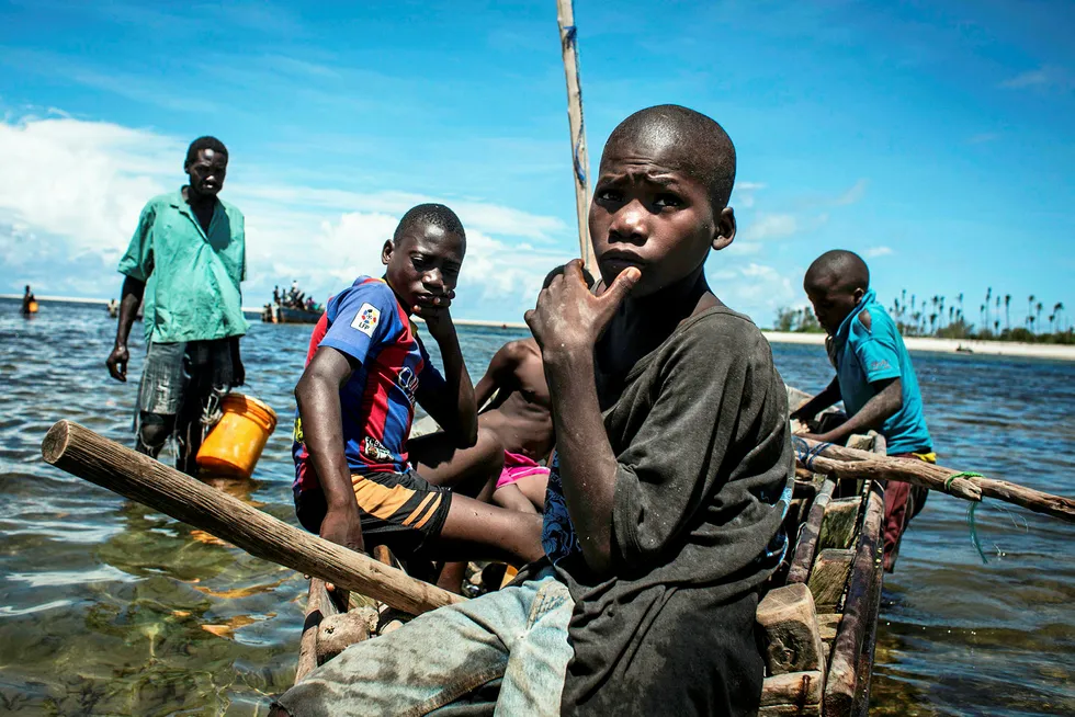 On the coast: fishermen return to shore in Palma, Mozambique, where ExxonMobil plans to site its LNG project