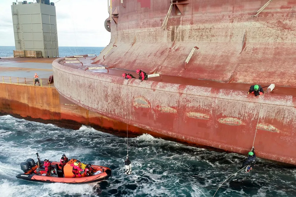 Boarding: Greenpeace activists climb on the Shell platform being transported to the North Sea last week.