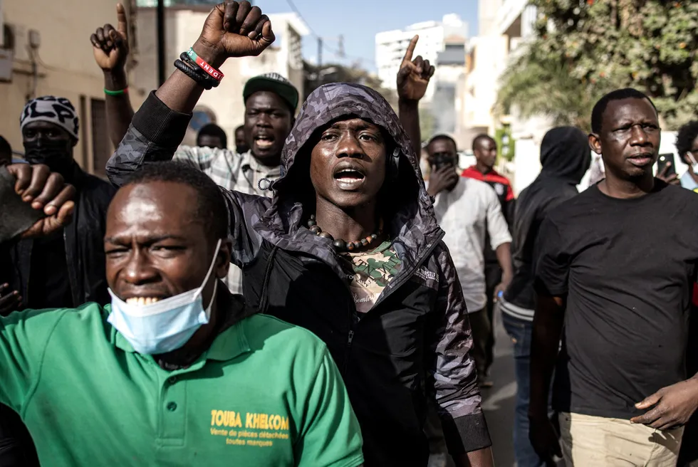 Street scene: Protesters gesture after police fired teargas at them outside the National Assembly in Dakar, Senegal, just before a decision was made to delay elections until December 2024.