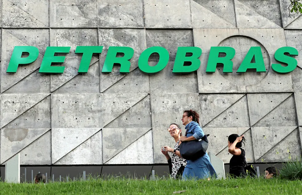 Confirmed case: people walk in front of Petrobras headquarters in Rio de Janeiro