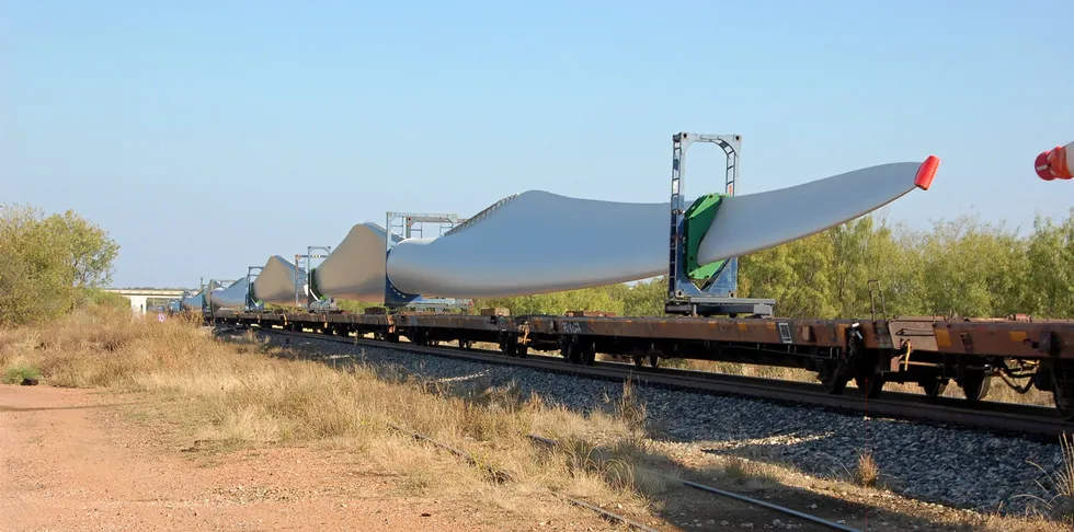 Wind turbine blades being transported by train through Baird, Texas