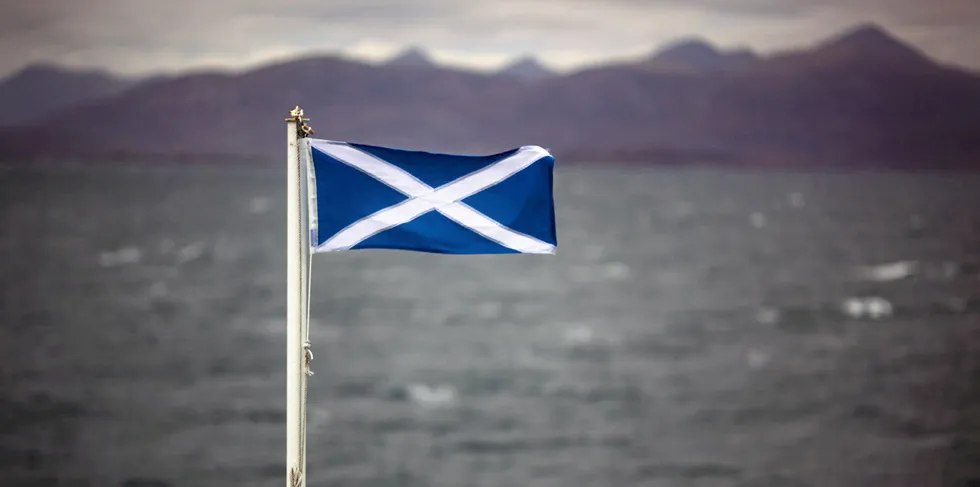 The Saltire flag flutters in the wind on board the Hebrides Caledonian MacBrayne ferry