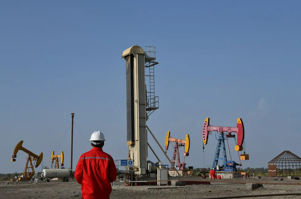 In production: A worker at at a Chinese oilfield operation.