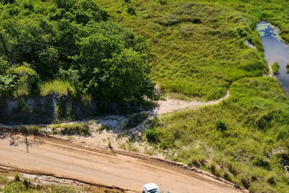 Fatalities: a car involved in an ambush on a convoy of vehicles carrying civilians from the Amarula Lodge hotel in Palma to the beach lies wrecked on the side of the road in Mozambique