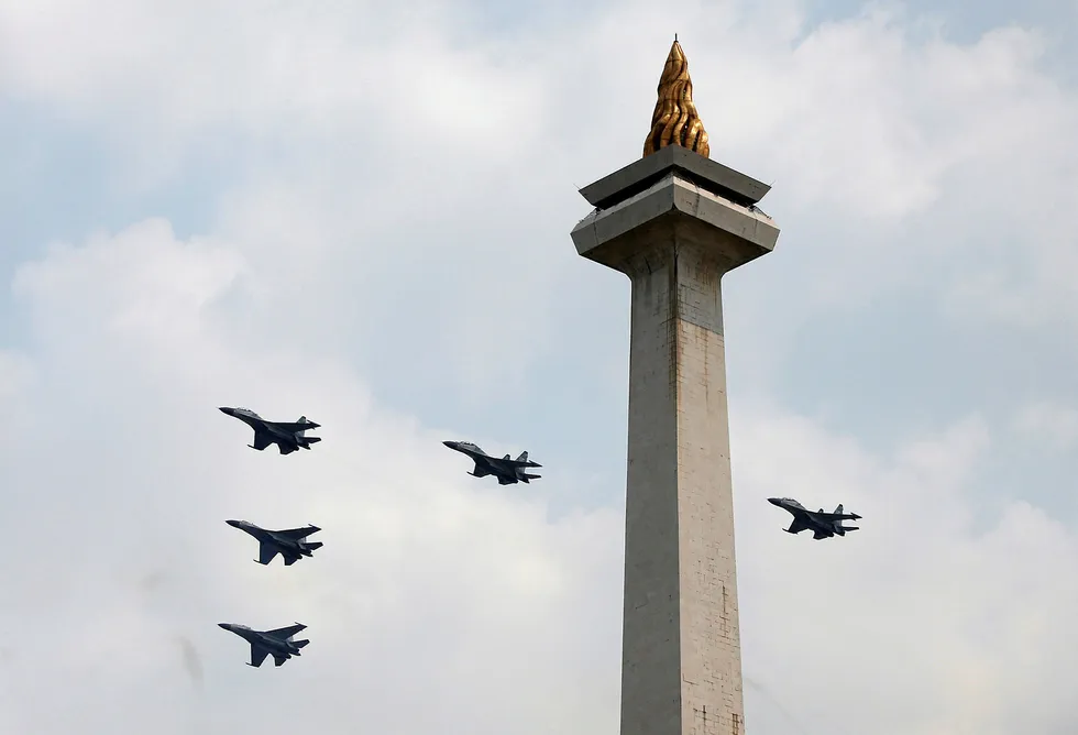 Flyby: Indonesian Air Force jets fly past the National Monument to mark the country's independence day in Jakarta on 17 August