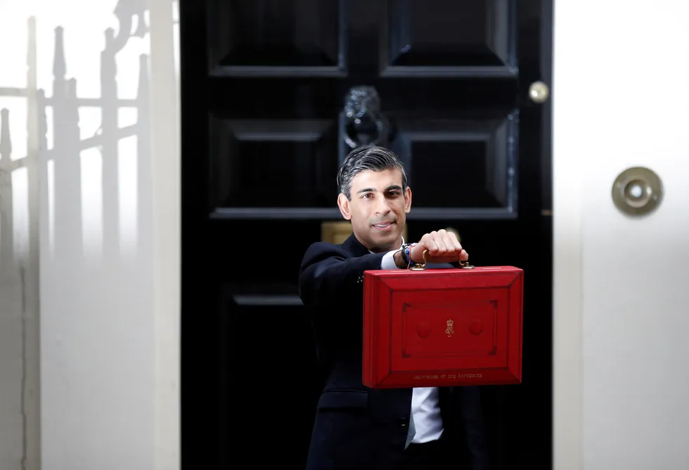 Budget day: UK Chancellor of the Exchequer Rishi Sunak holds the budget box outside Downing Street in London earlier on Wednesday