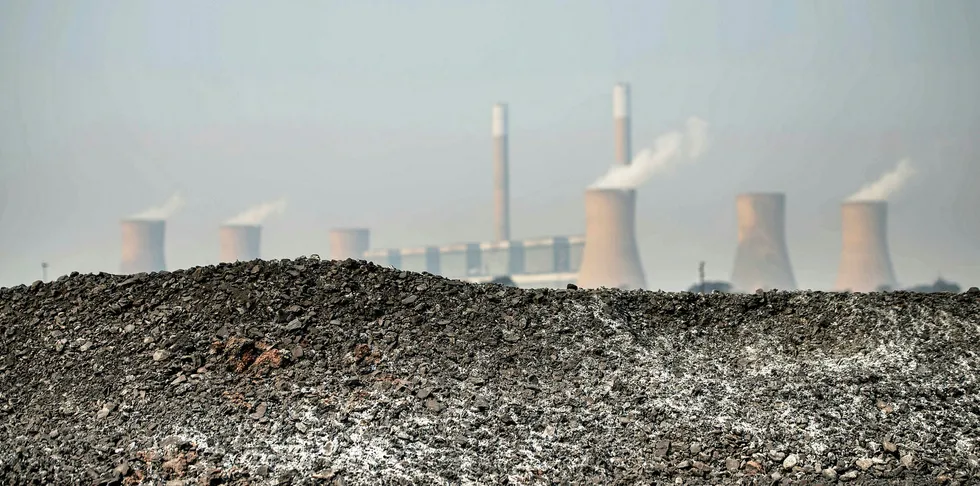 This photo on the outskirts of Witbank, South Africa, shows a pile of coal in front of the coal-fired Duvah power plant.