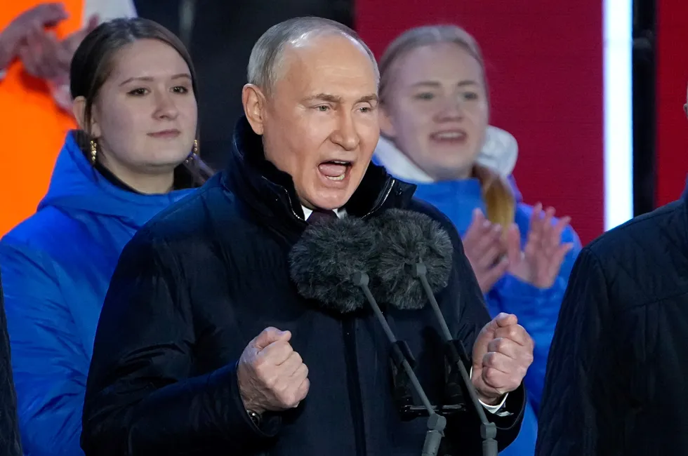 Warning: Russian President Vladimir Putin gestures while addressing a crowd celebrating his re-election earlier this week.