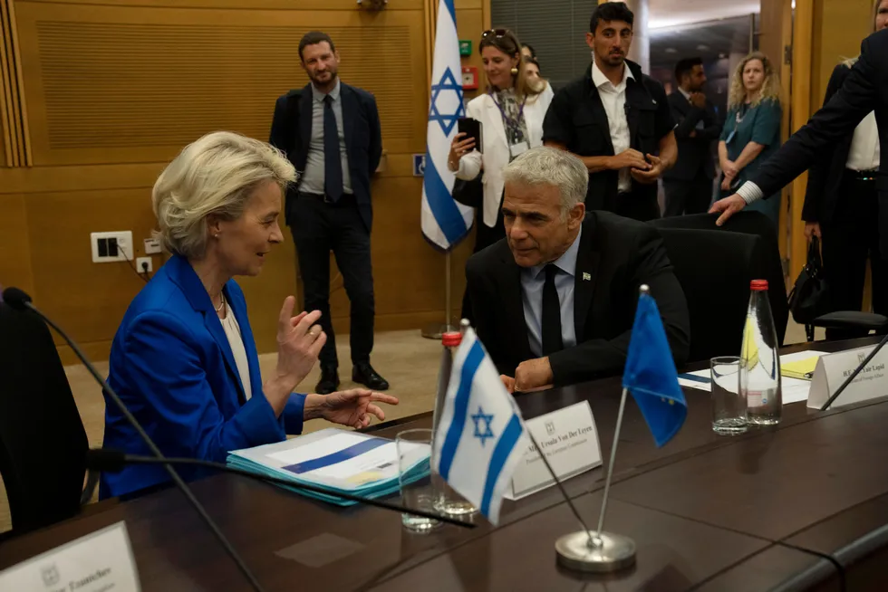 European Commission President Ursula von der Leyen, left, talks with Israeli Foreign Minister Yair Lapid before their meeting in the Knesset, Israel's Parliament, in Jerusalem on 13 June, 2022