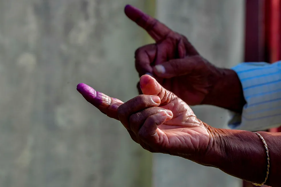 Controversy: Guyanese citizens show their inked fingers after voting on 2 March, but the results remain obscured by intrigue over voting procedures